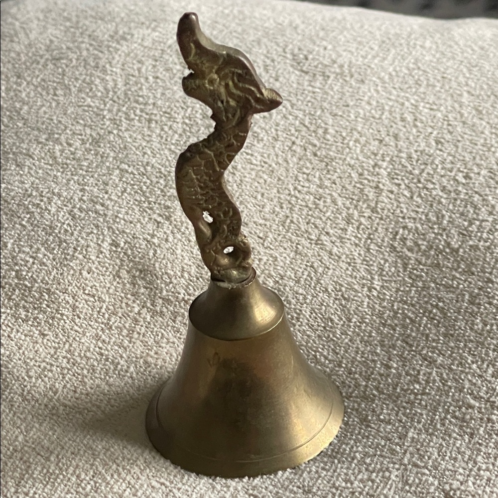 Vintage solid Brass Bell, posing dragon/sea serpent, made in India. EUC